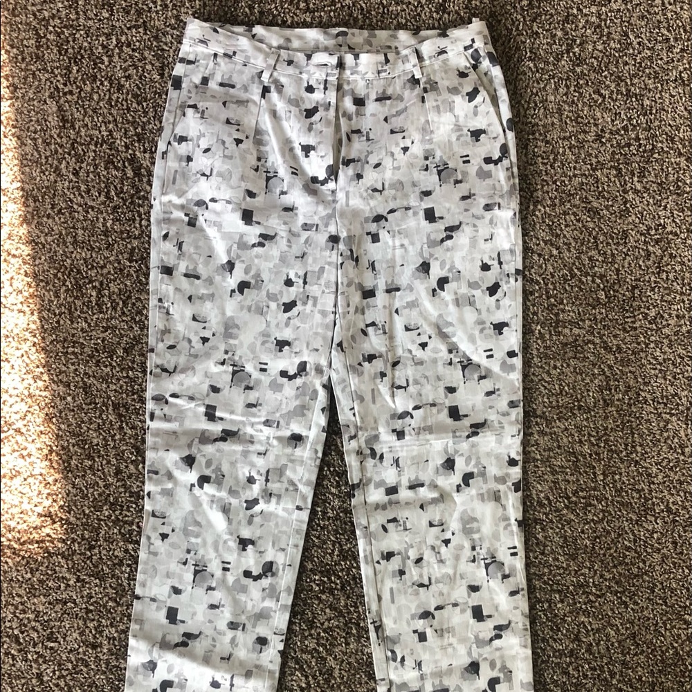 White pants with geometric black and gray pattern